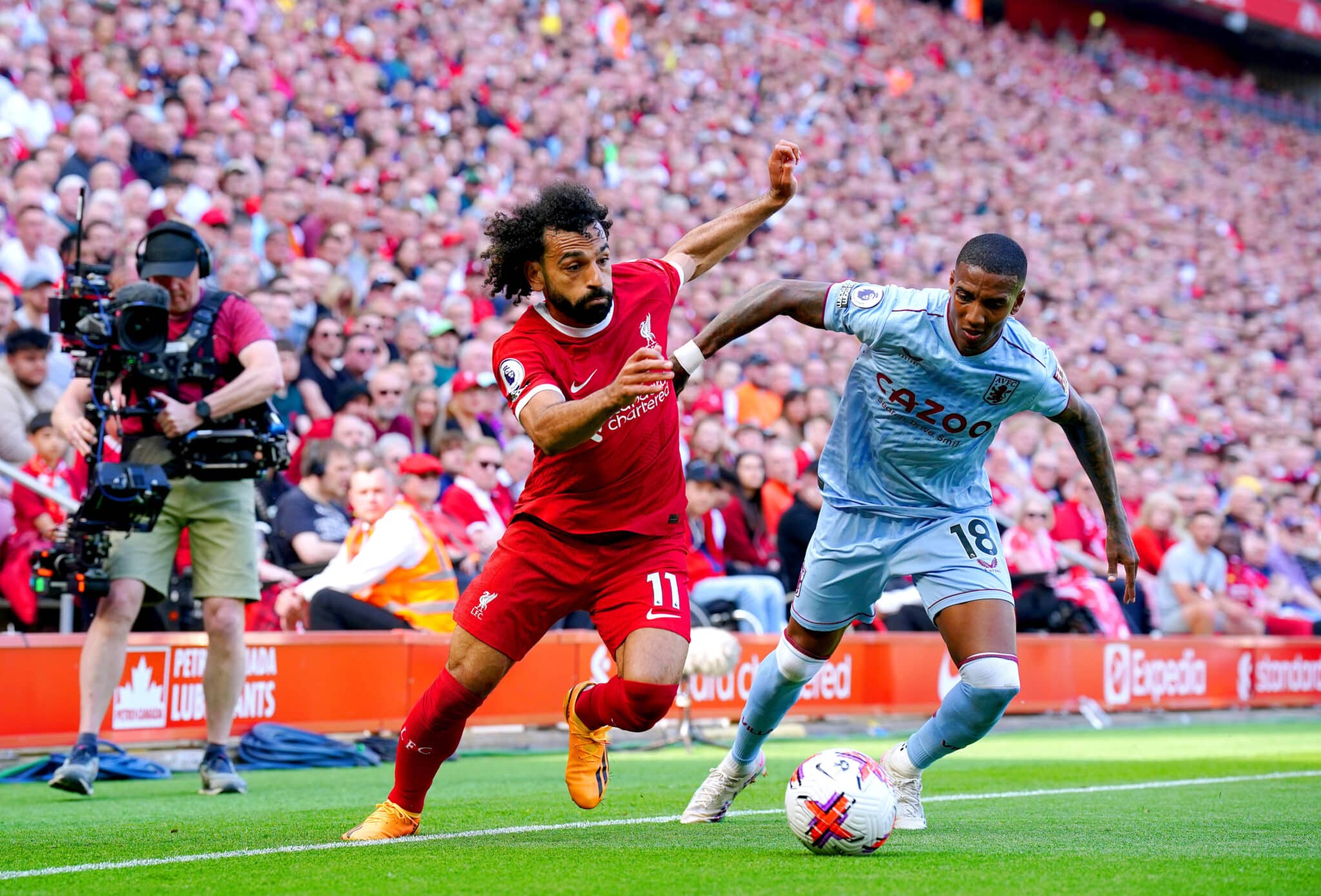 Mohamed Salah takes on a player for Liverpool