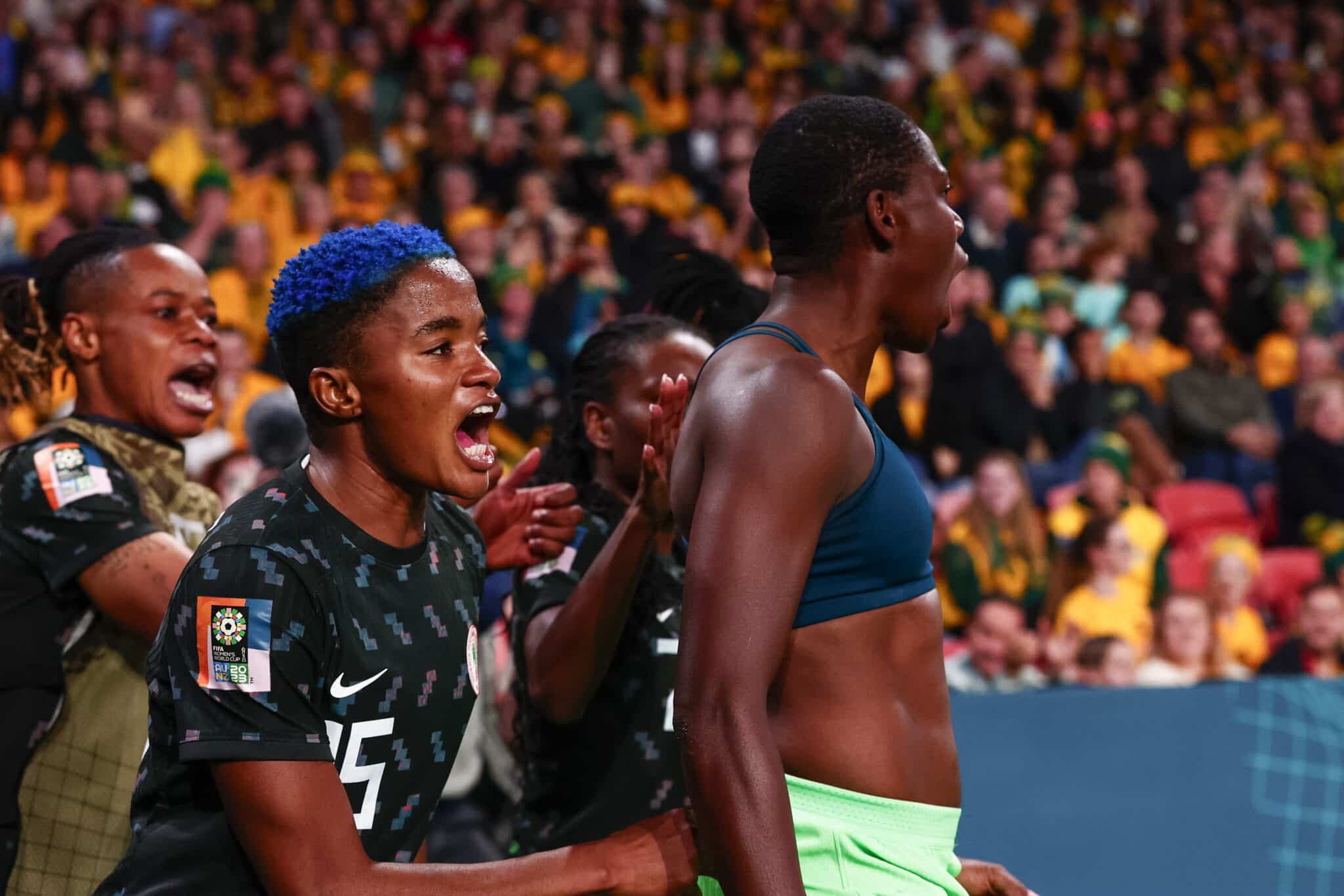 Asisat Oshoala (R) of Nigeria celebrates with team mate Rasheedat Ajibade