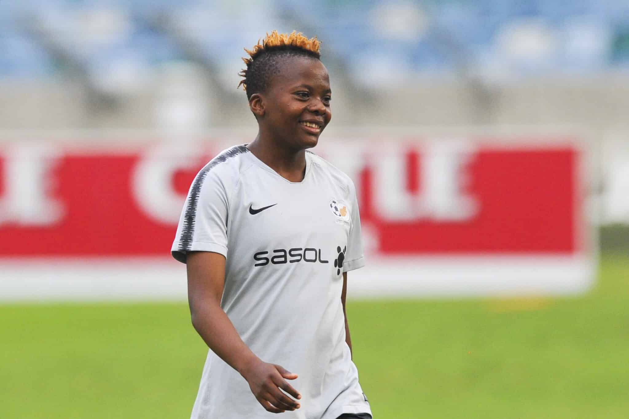 Thembi Kgatlana smiles before a match