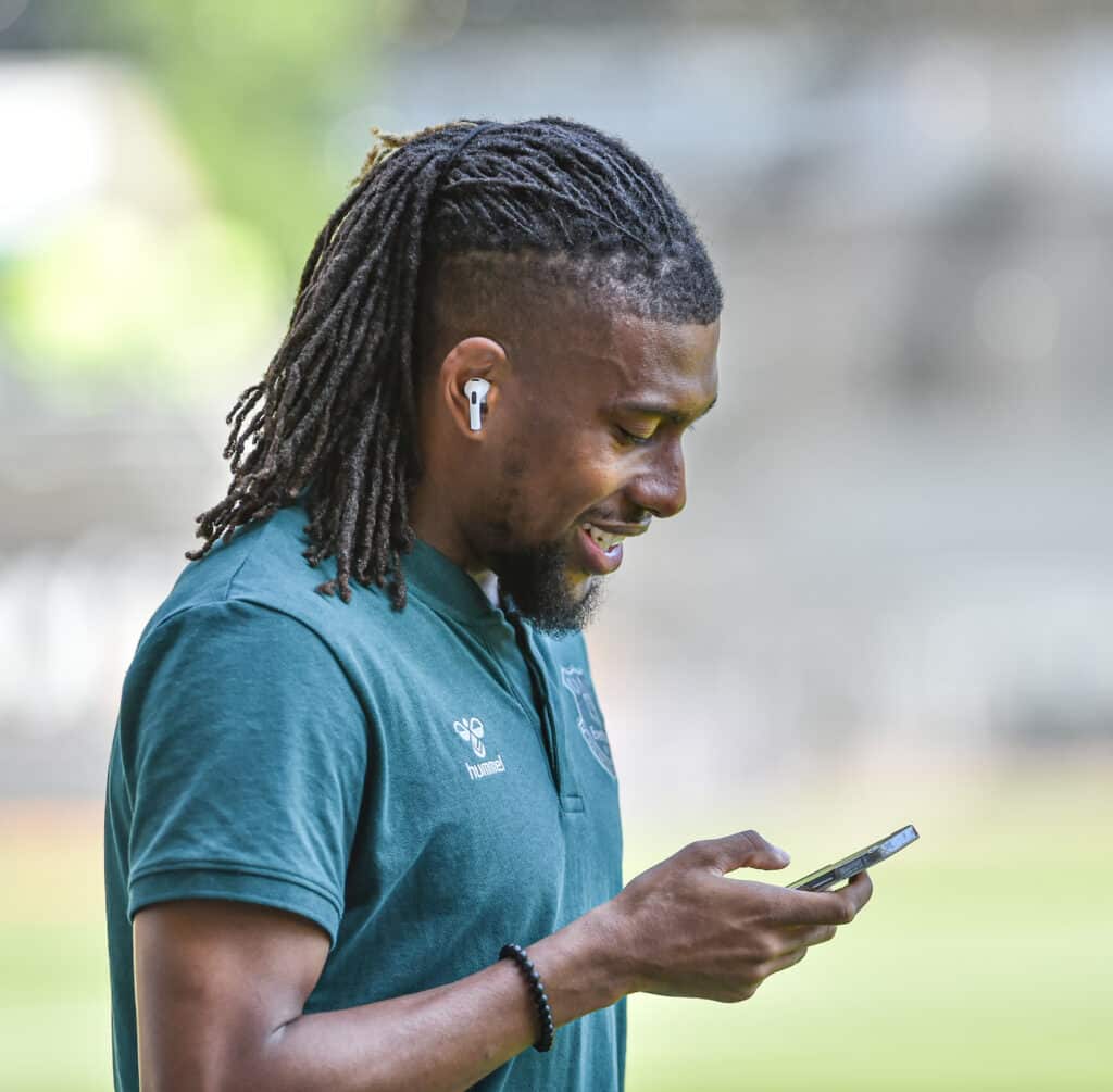 Super Eagles winger Alex Iwobi finds something funny