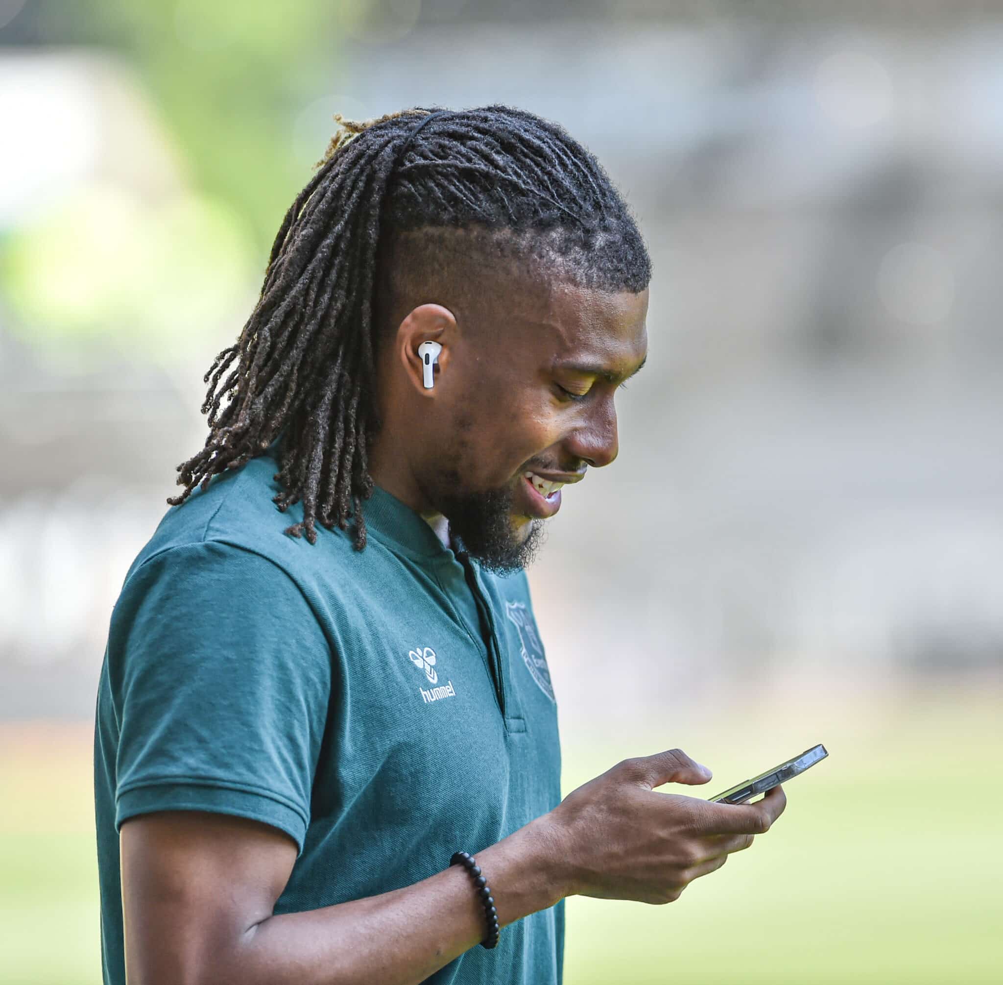 Super Eagles winger Alex Iwobi finds something funny