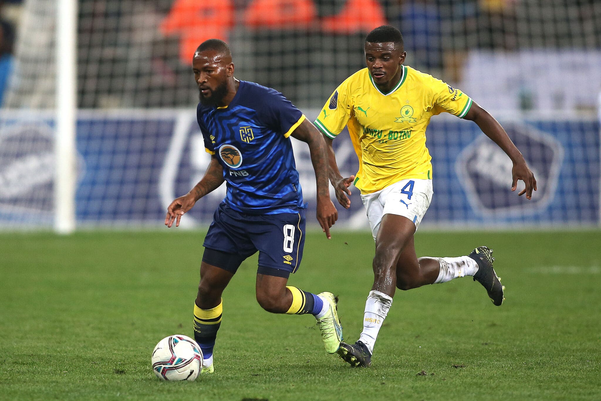 Mpho Makola of Cape Town City keeps possession away from Teboho Mokoena of Mamelodi Sundowns 