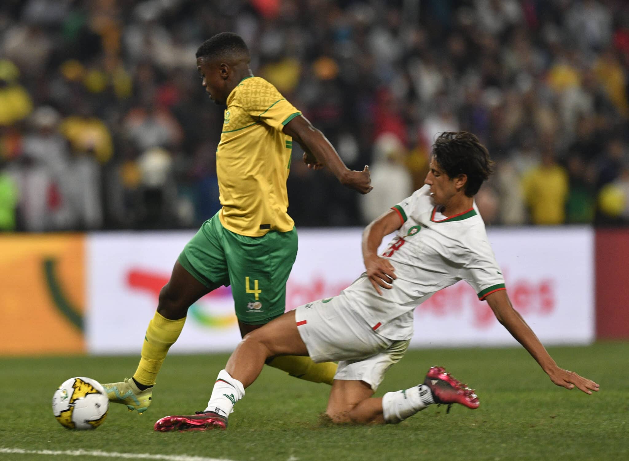 Teboho Mokoena of South Africa challenged by Youssef Maleh of Morocco during the 2023 Africa Cup of Nations Qualifiers