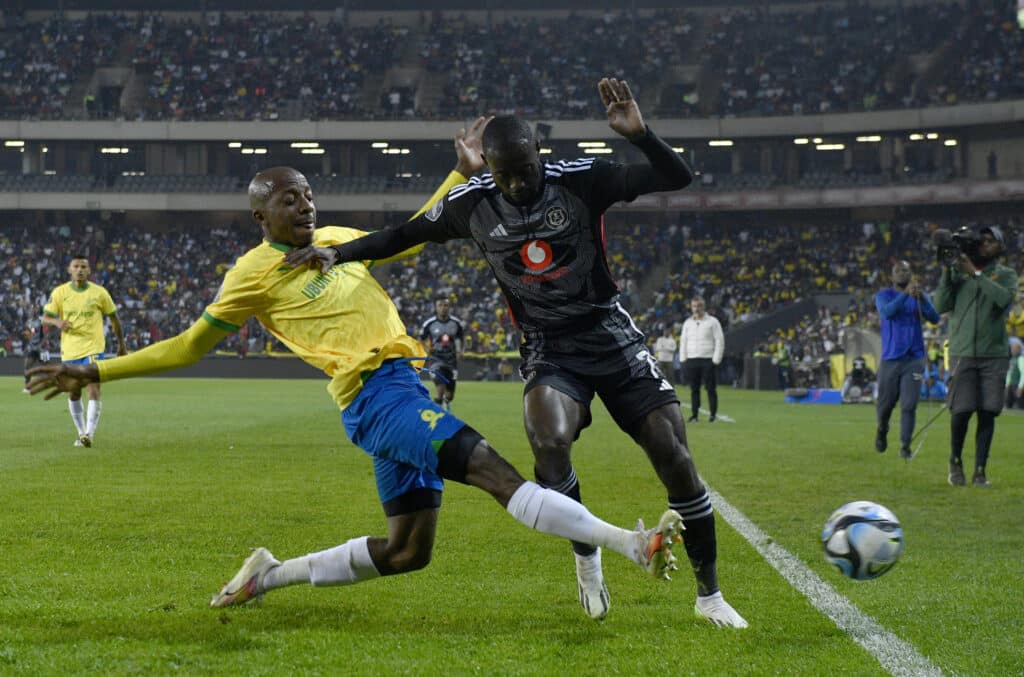 Deon Hotto of Orlando Pirates challenged by Khuliso Mudau of Mamelodi Sundowns during the DStv Premiership 