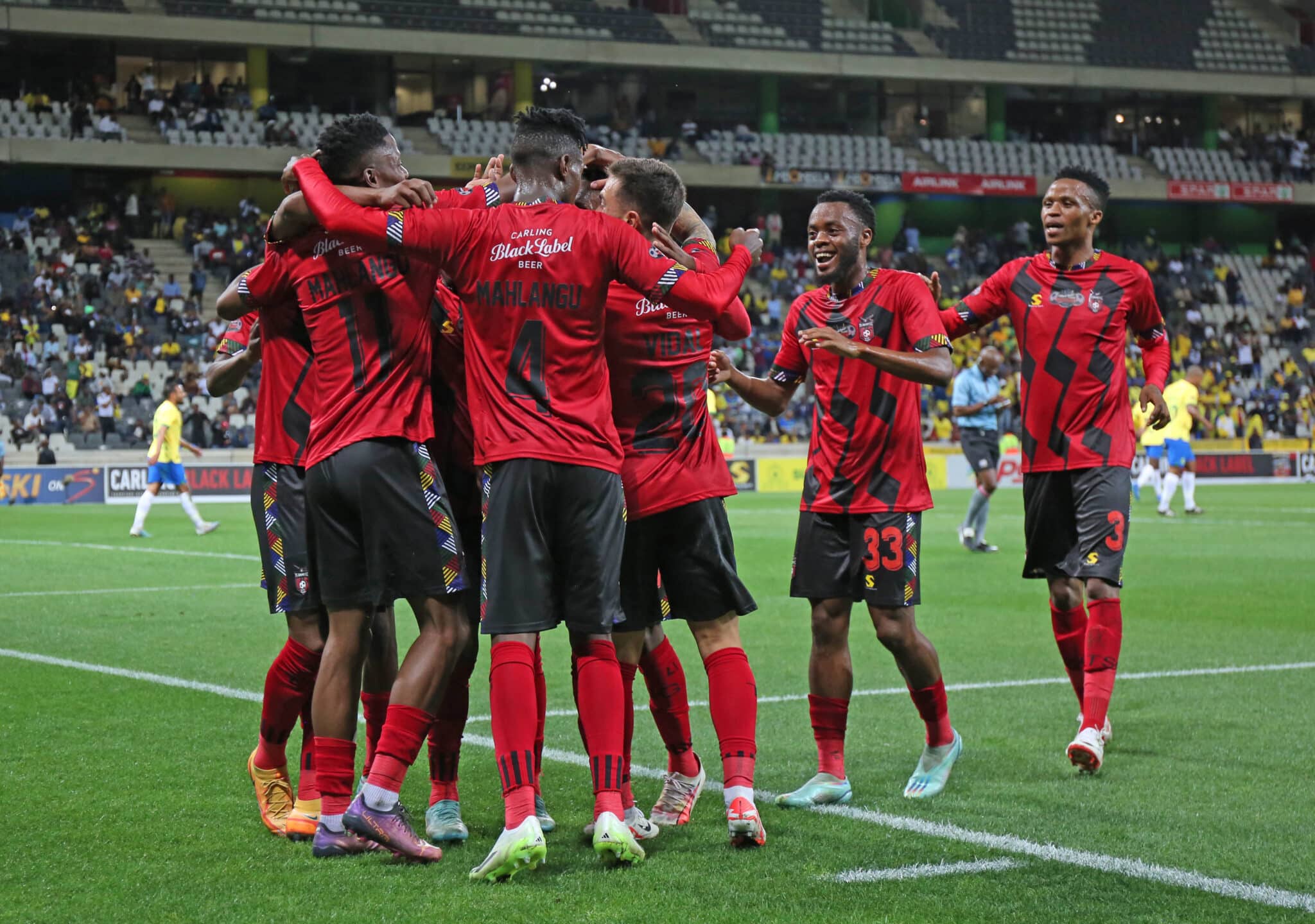 TS Galaxy players celebrate their win over Mamelodi Sundowns in the Carling Knockout