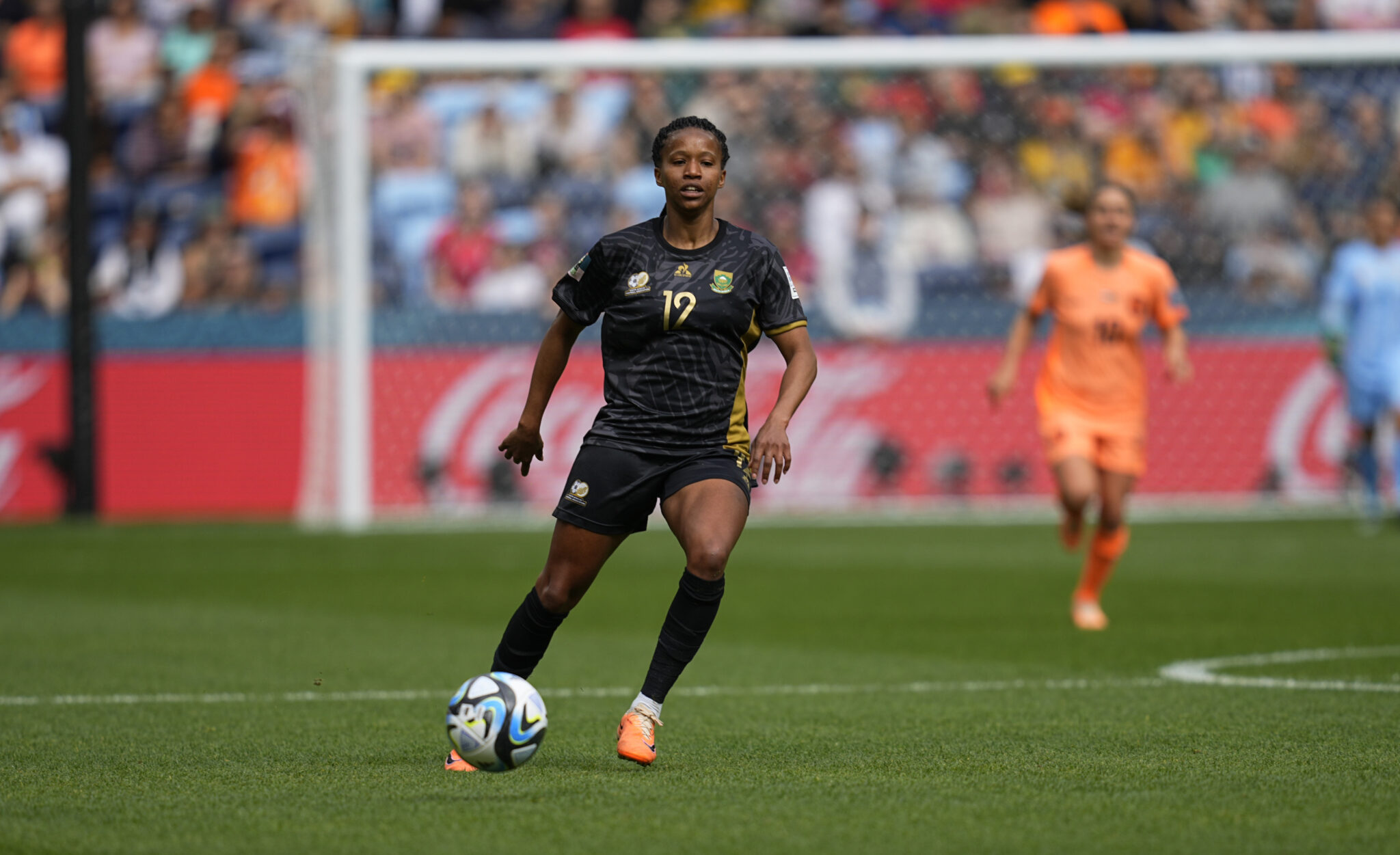 Jermaine Seoposenwe (South Africa) controls the ball during a game