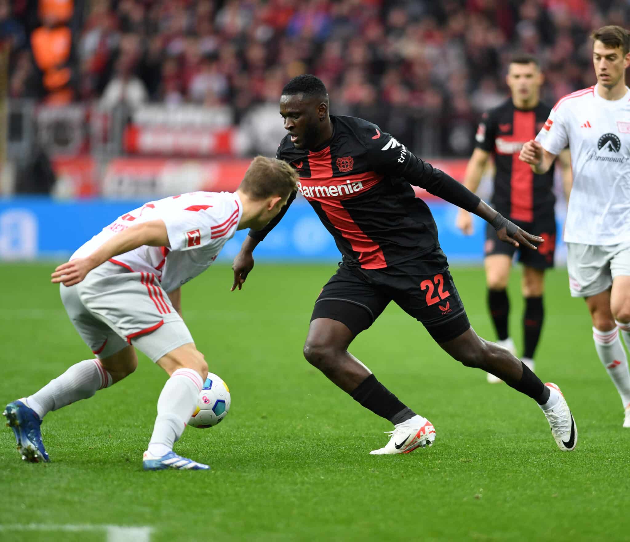 victor boniface tries to get past an opponent