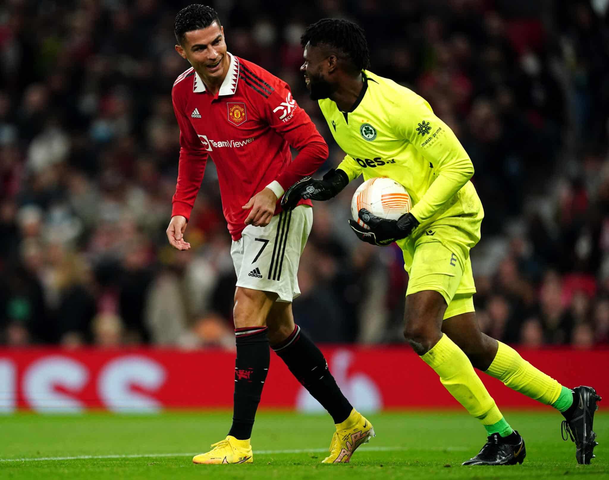 Manchester United's Cristiano Ronaldo with Omonia goalkeeper Francis Uzoho