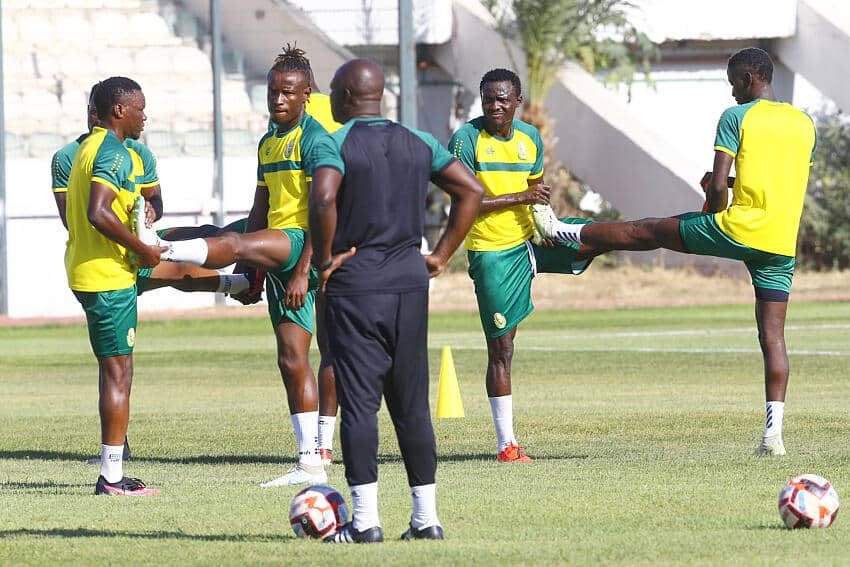 Coach Monday Adigie with his Bendel Insurance team