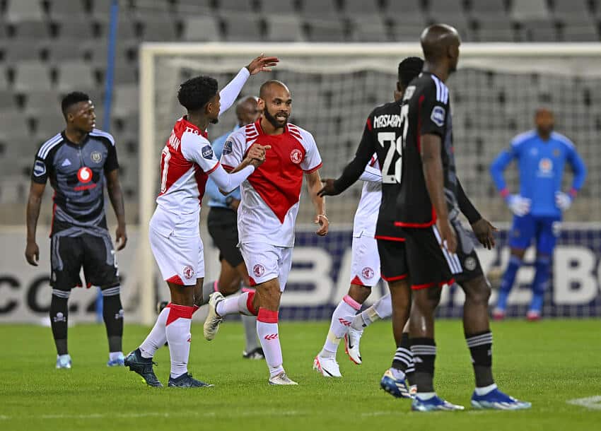 Spurs players celebrate scoring