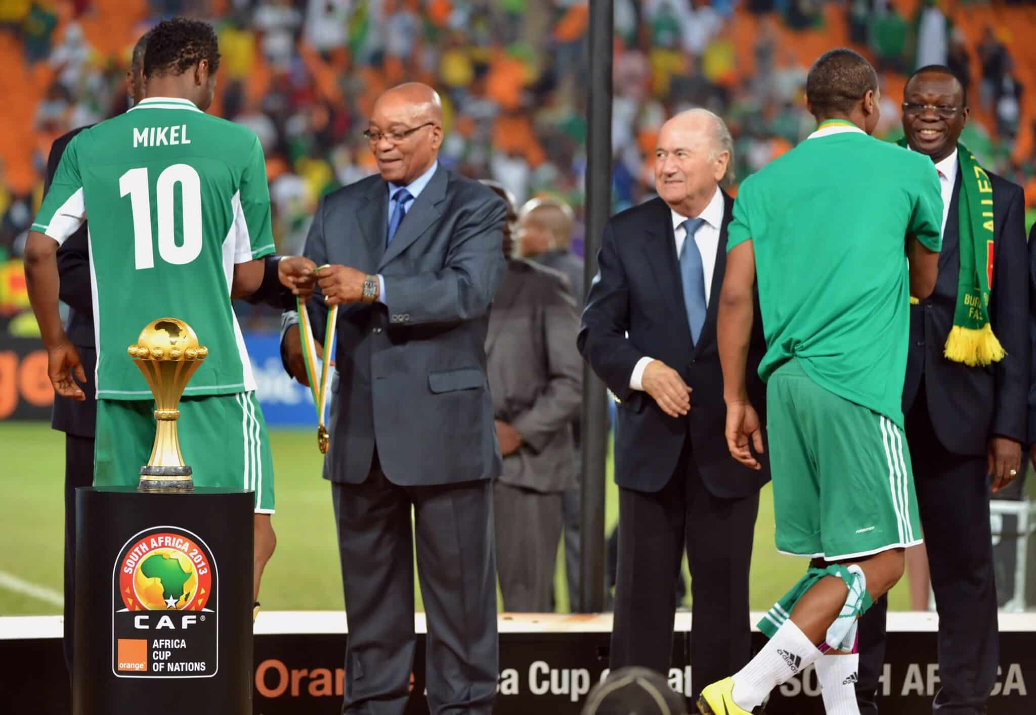 mikel obi lifting the afcon trophy