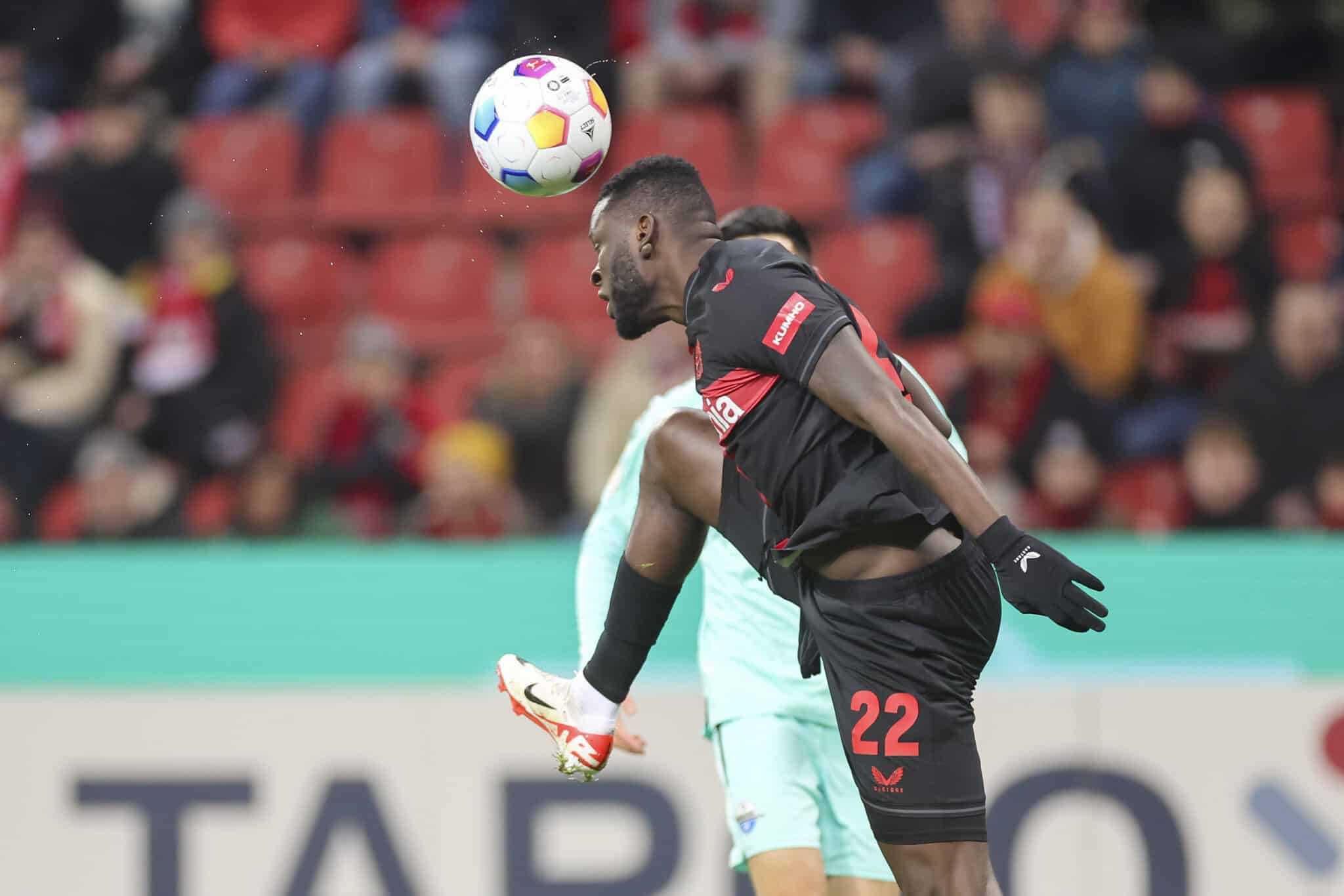 Victor Boniface heads the ball for Leverkusen in the DFB Pokal