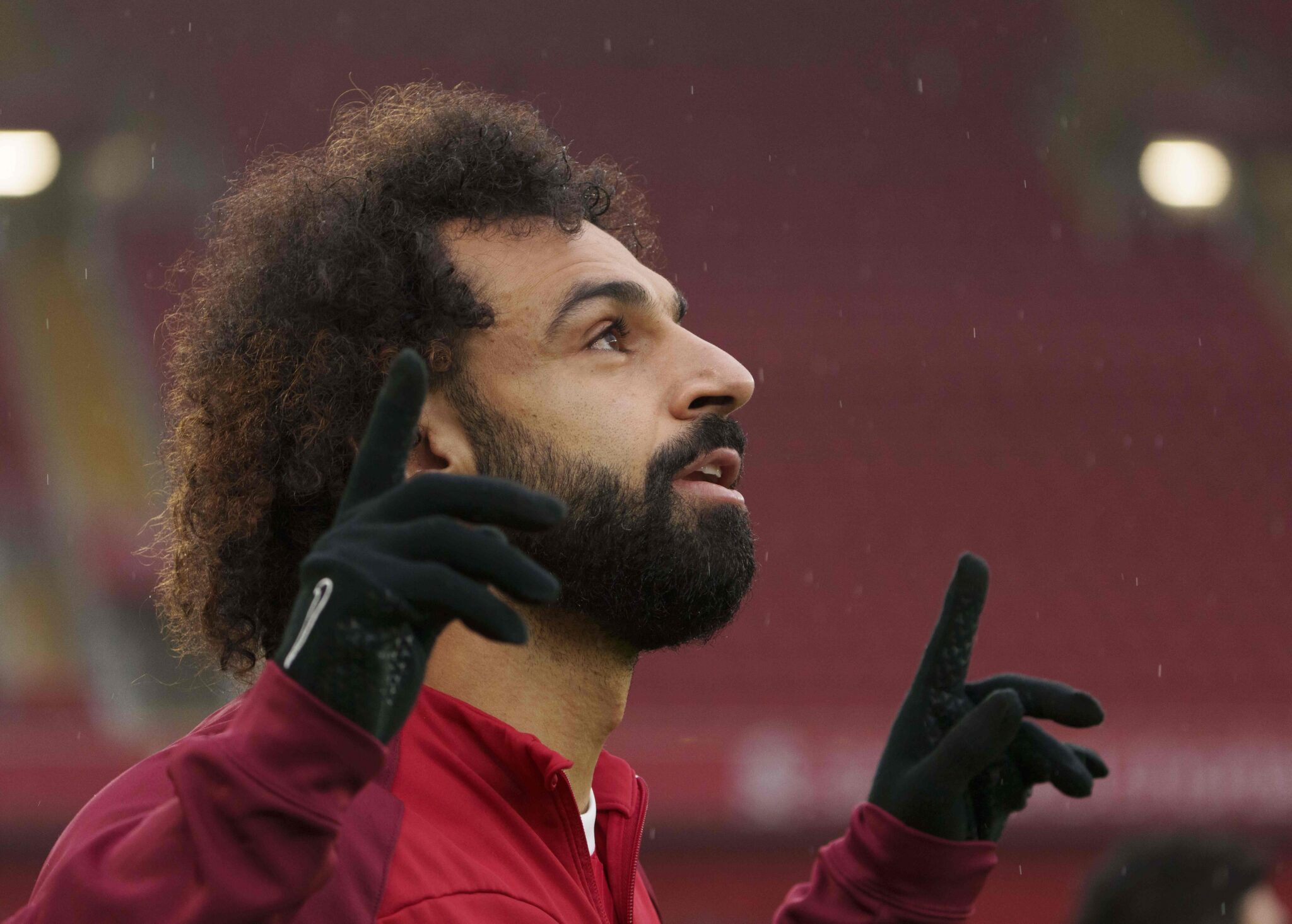 Mohamed Salah of Liverpool prays as he emerges from the tunnel before the Premier League match
