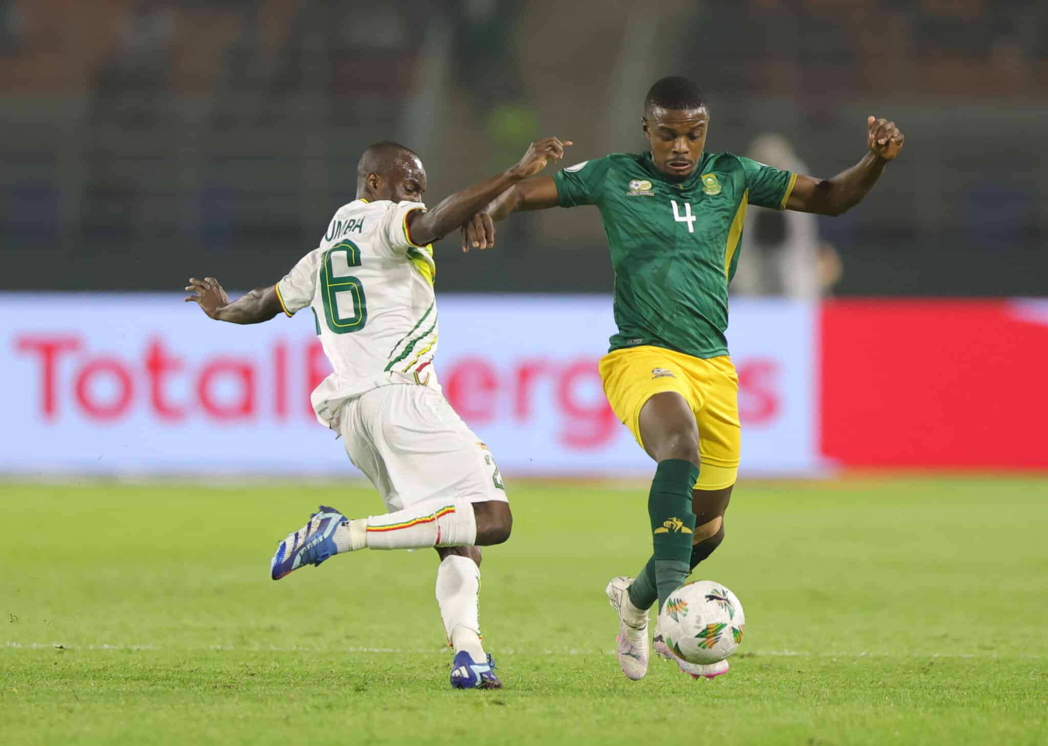Teboho Mokoena of South Africa challenged by Sikou Niakate of Mali 