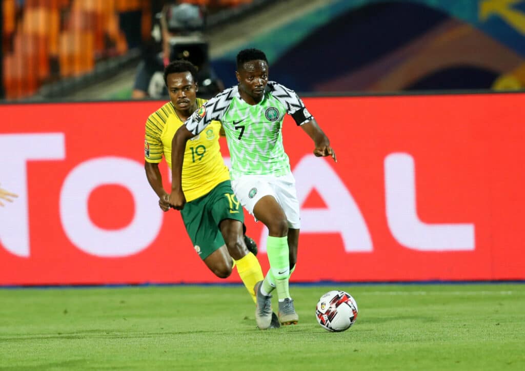 Ahmed Musa of Nigeria challenged by Percy Tau of South Africa during the 2019 Africa Cup of Nations Finals, quarterfinals match between Nigeria and South Africa at Cairo International Stadium
